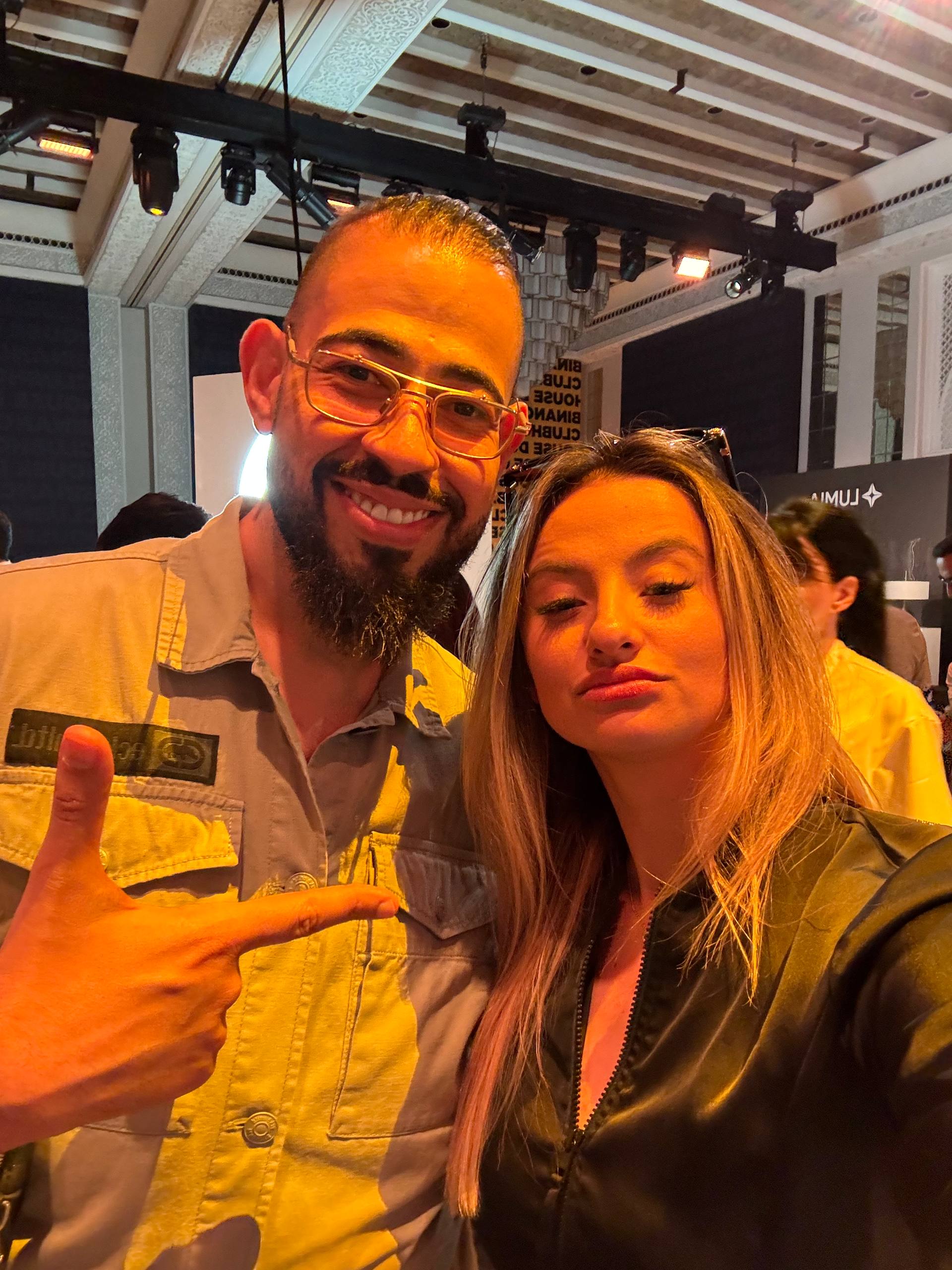 Jana at Binance Clubhouse with warm golden lighting