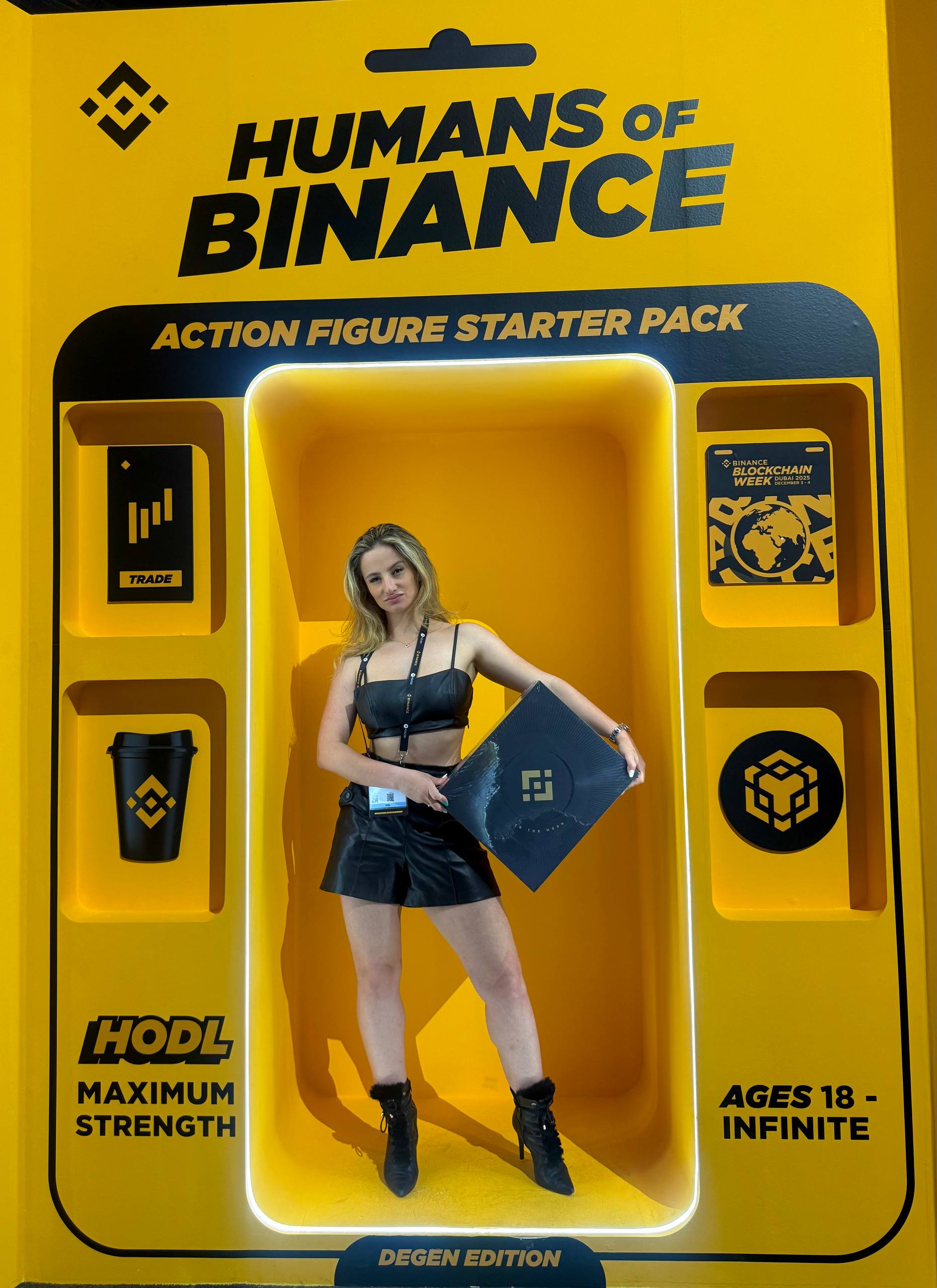 Jana inside the Binance Humans of Binance Action Figure box — DEGEN EDITION at Blockchain Week Dubai